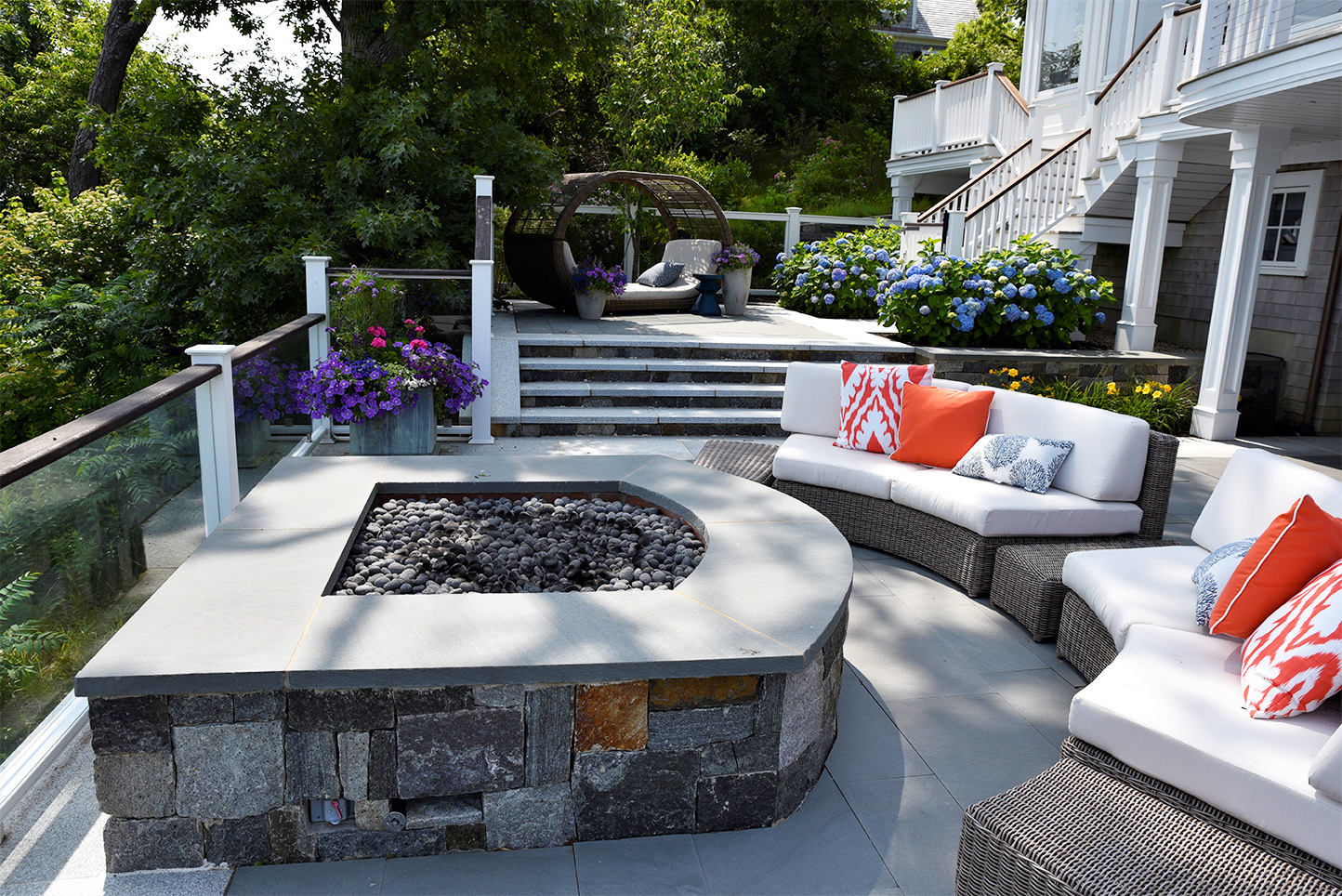 fire pit along glass railing with seating